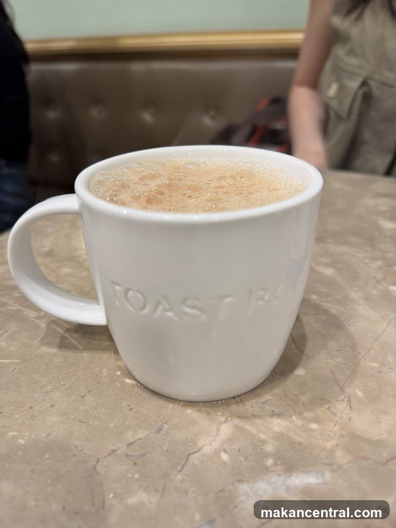 Foamy Drink in a White Mug