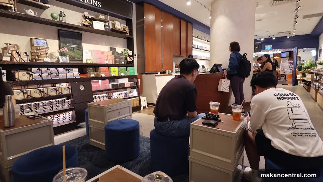 Interior of a retail store with products on shelves and customers