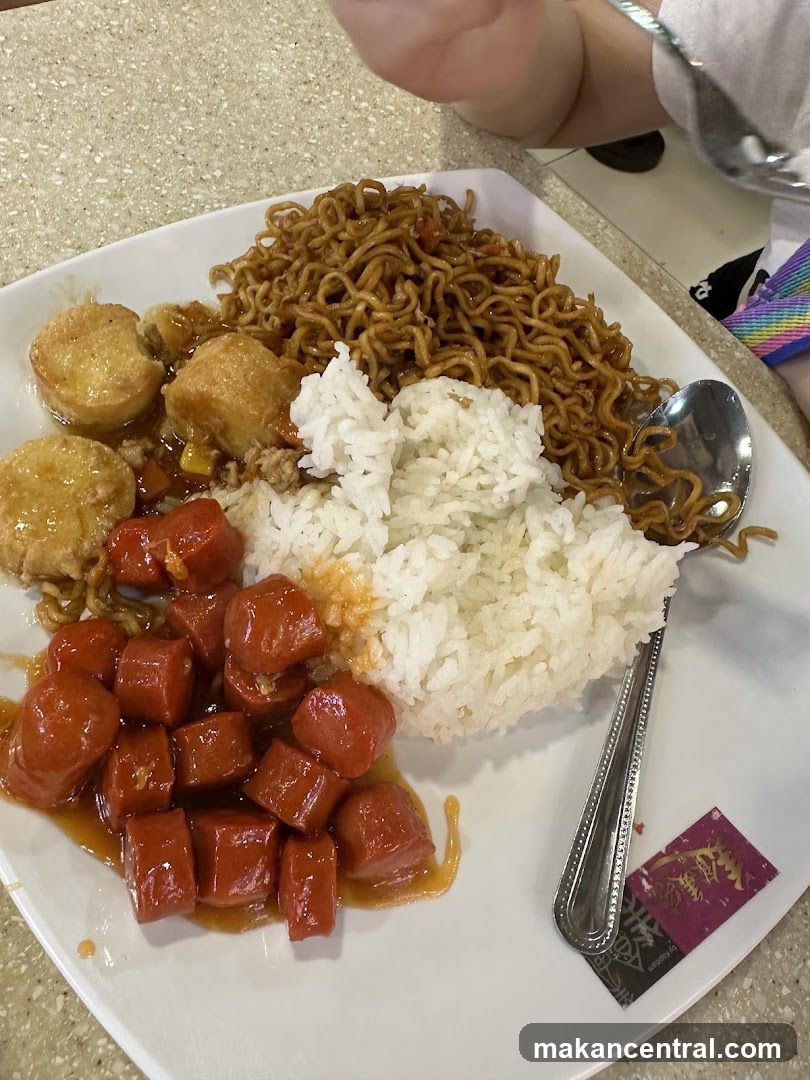 Plate of Food with Noodles, Rice, and Sausages