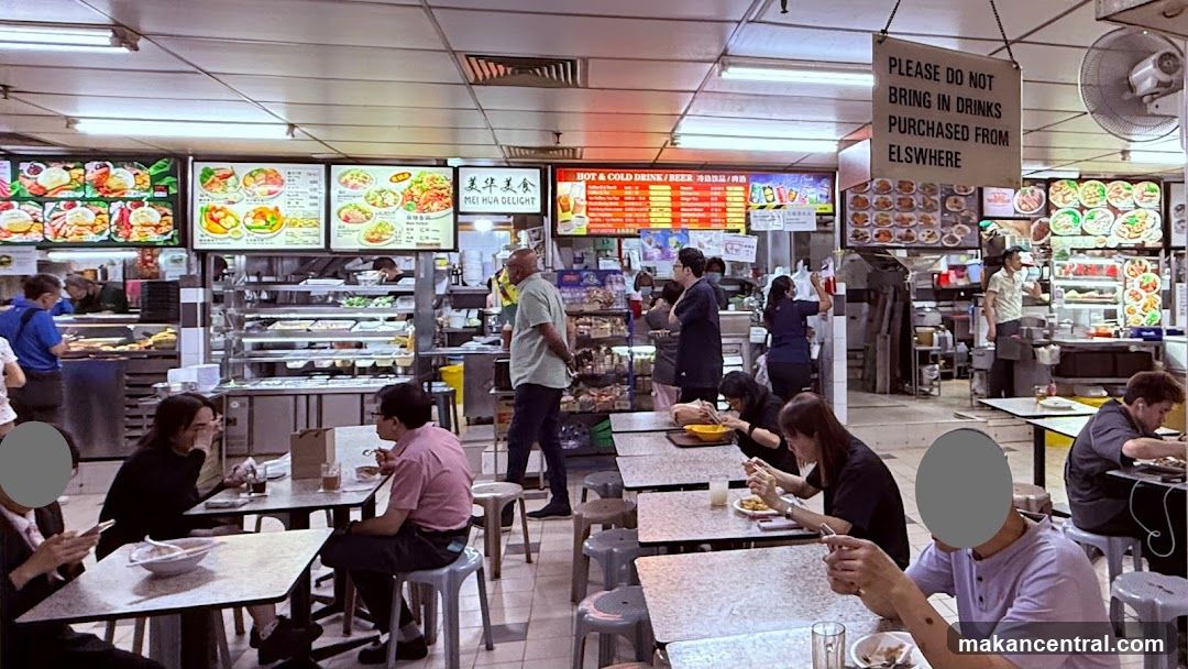 Food court with various food stalls and dining tables