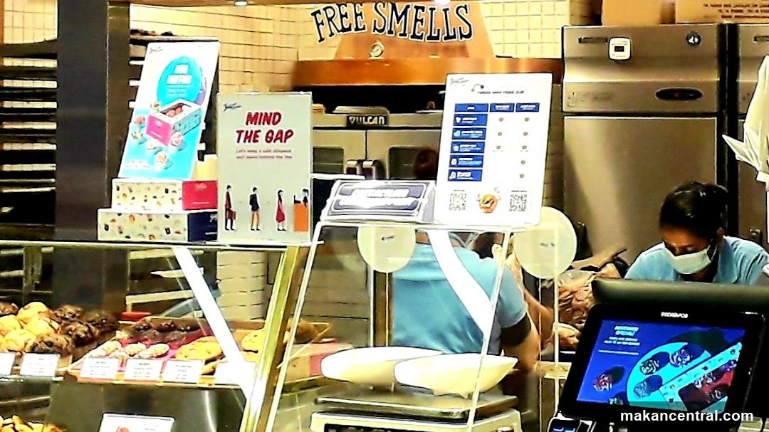 Bakery Counter with Pastries and Staff