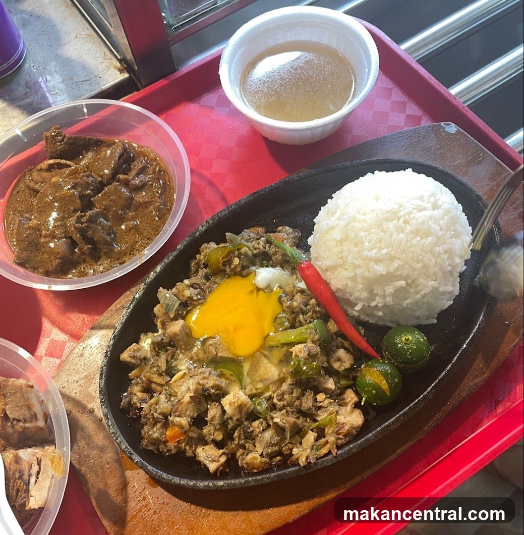 Sizzling Sisig with Rice and Side Dishes