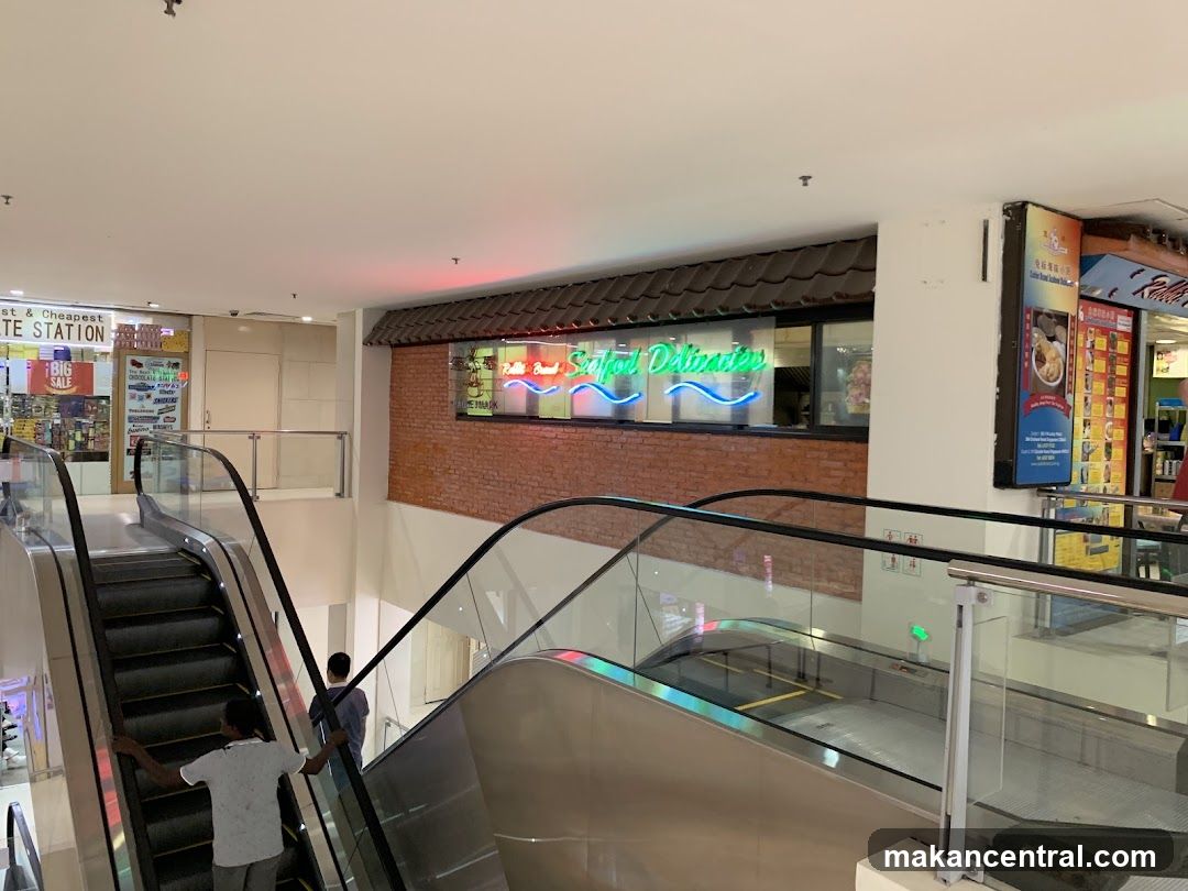 Mall Interior with Escalators and Shops
