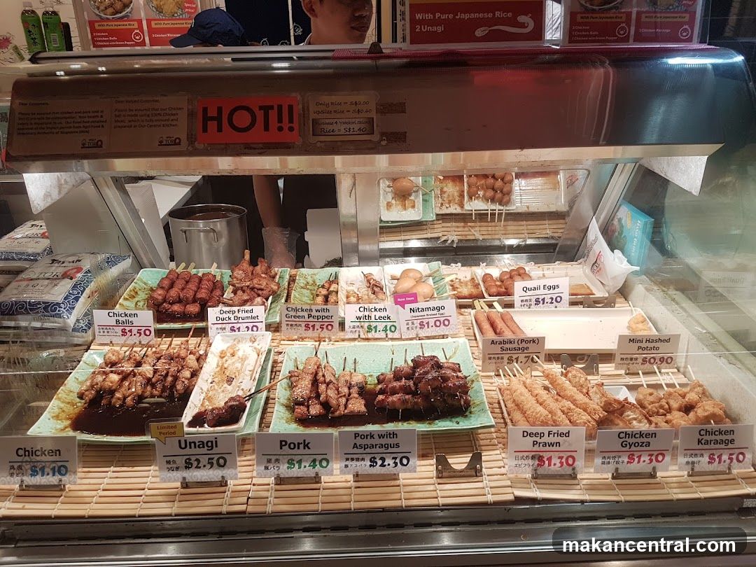 Food display with various skewers and side dishes