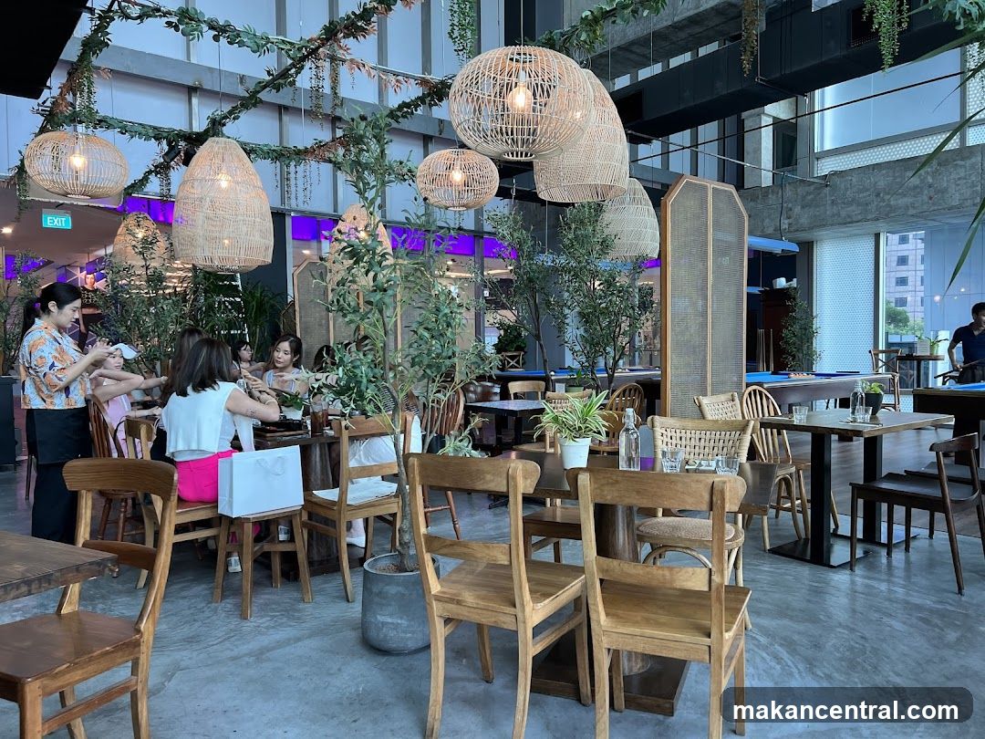 Restaurant Interior with Greenery and Pool Tables