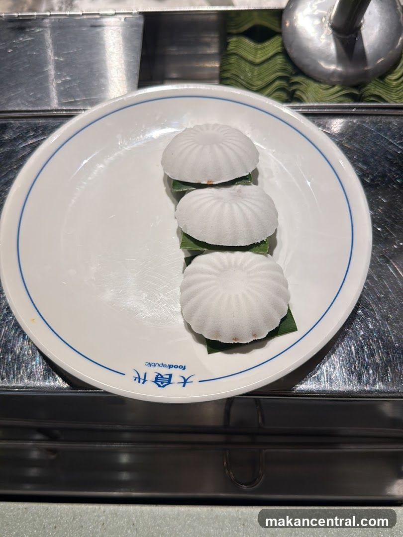 Three white desserts on a plate