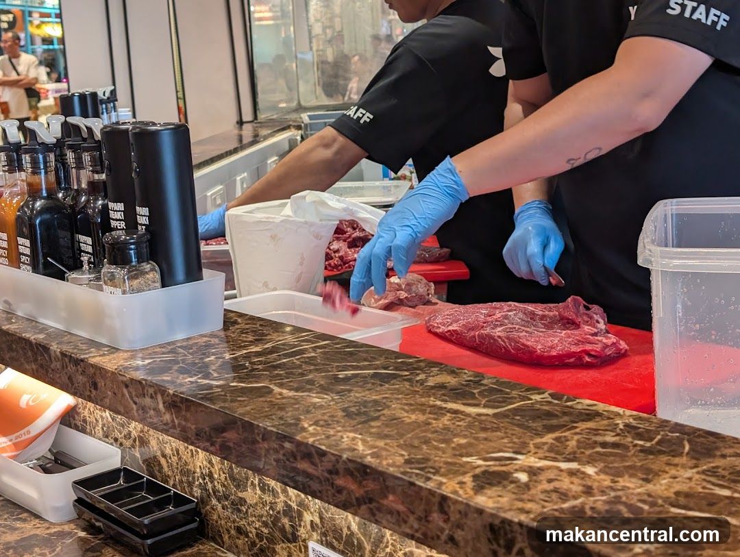 Butcher preparing meat