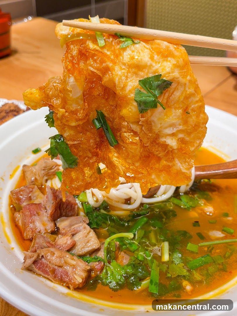 Noodle Soup with Fried Egg and Meat