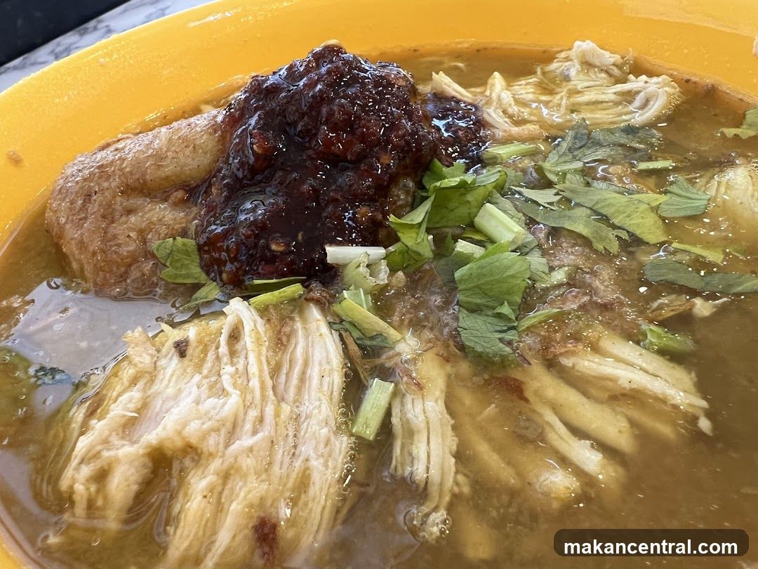 Bowl of Noodles with Shredded Chicken and Chili Paste