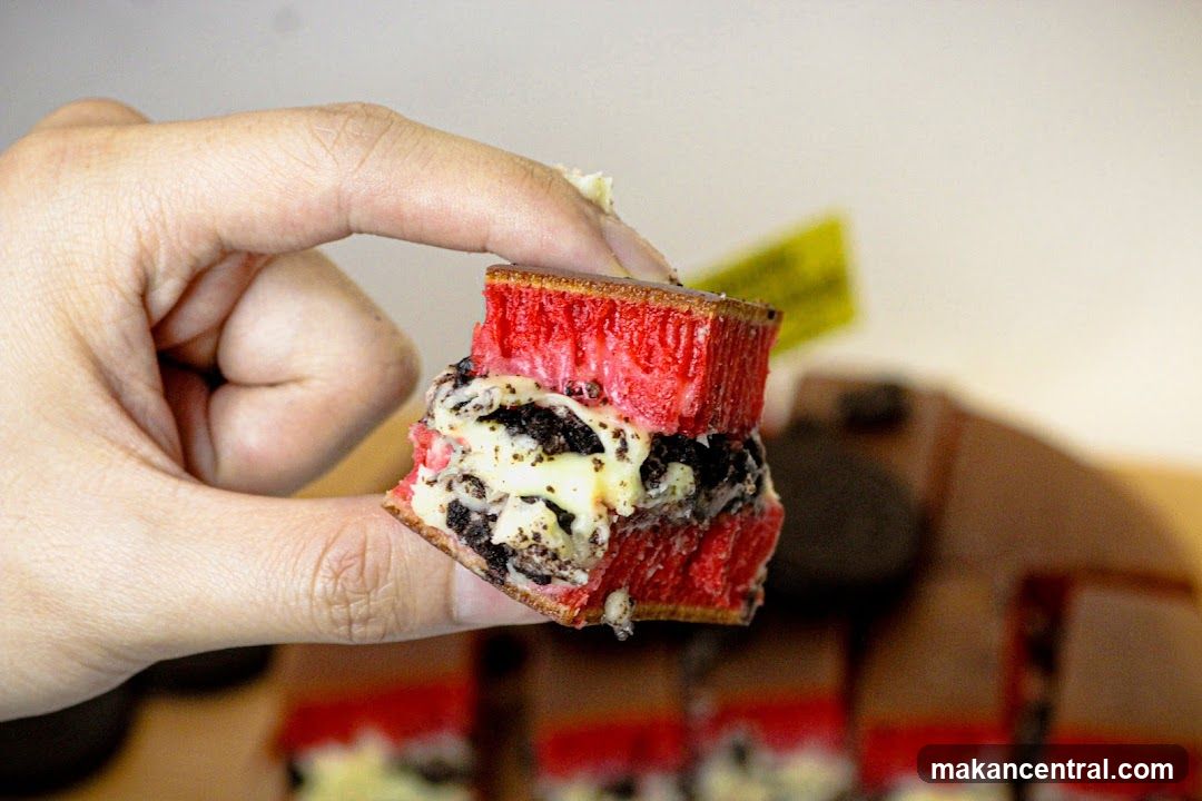 Close-up of a red dessert with cookies and cream filling
