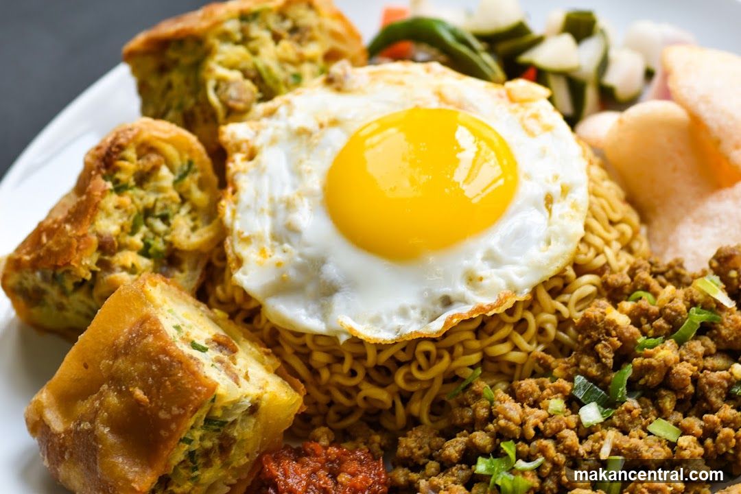 Noodle Dish with Fried Egg and Sides