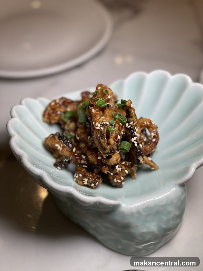 Crispy Fried Dish with Sesame Seeds and Scallions