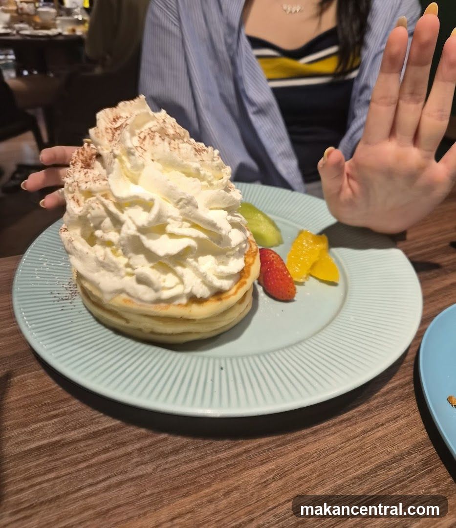 Fluffy Pancakes with Whipped Cream and Fruit
