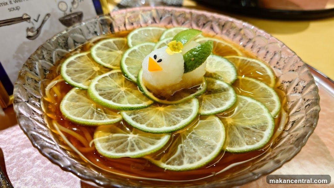 Noodle Dish with Lime and Bird Garnish
