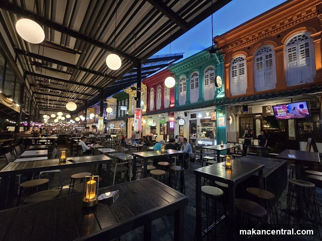 Outdoor dining area with colorful buildings