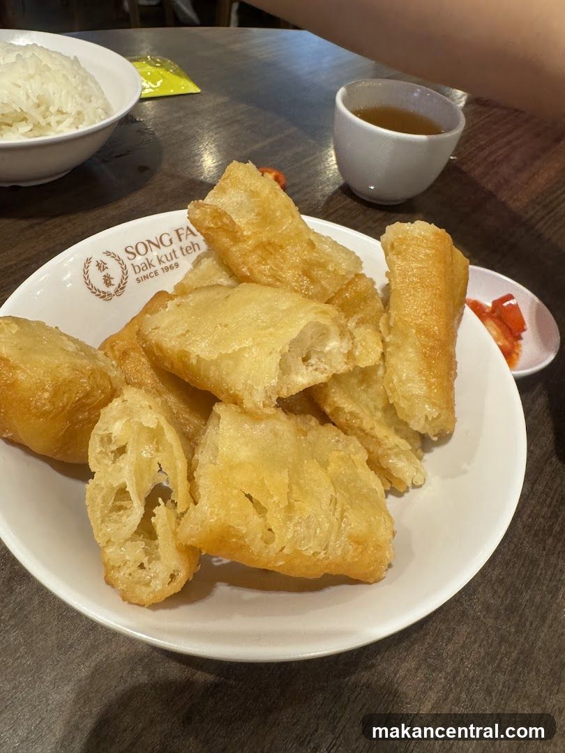 Fried Dough Sticks with Rice and Tea