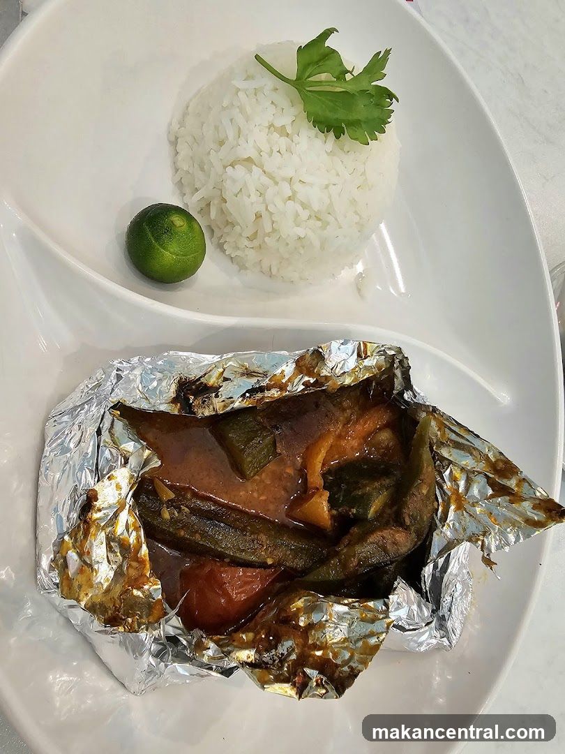 Foil-wrapped dish with rice