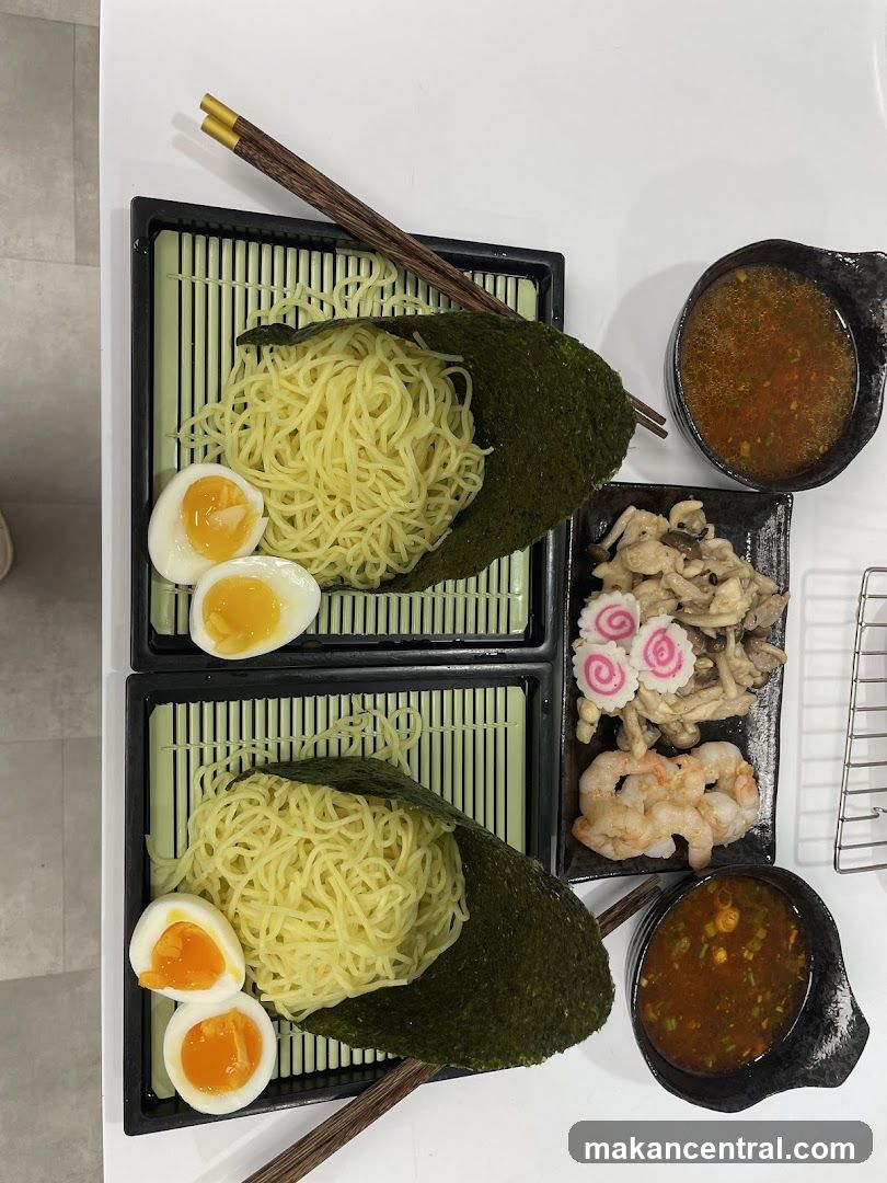 Two servings of ramen noodles with toppings
