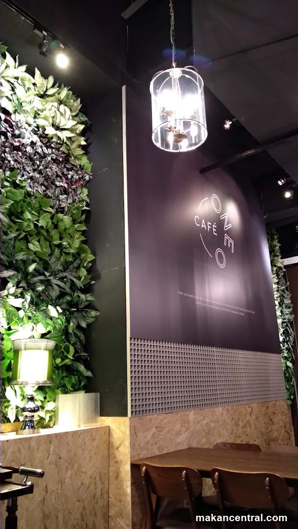 Cafe Interior with Green Wall and Logo