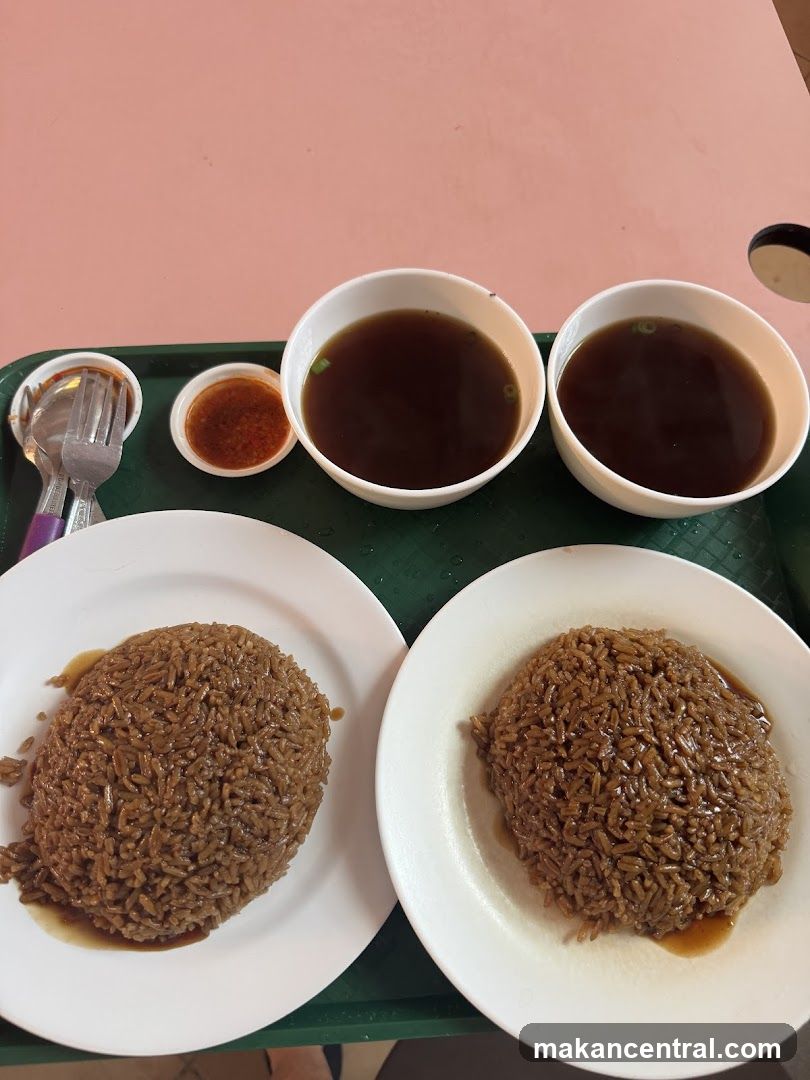 Two plates of rice with soup