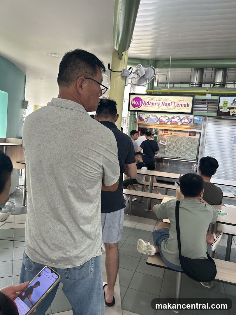 People queuing at a food stall
