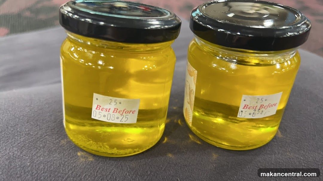 Two Jars of Yellow Liquid