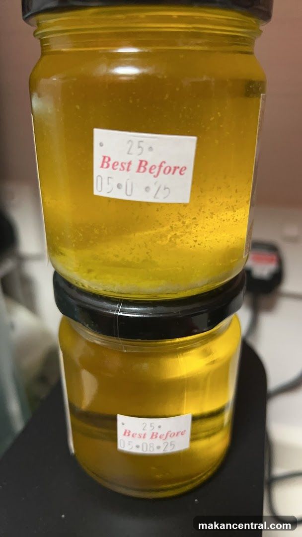 Two Jars of Yellow Liquid