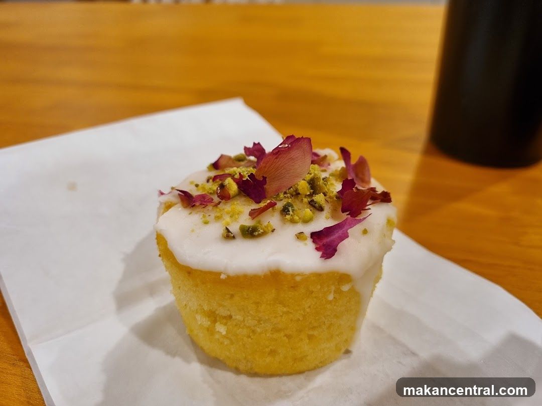 Cupcake with White Icing and Pistachios
