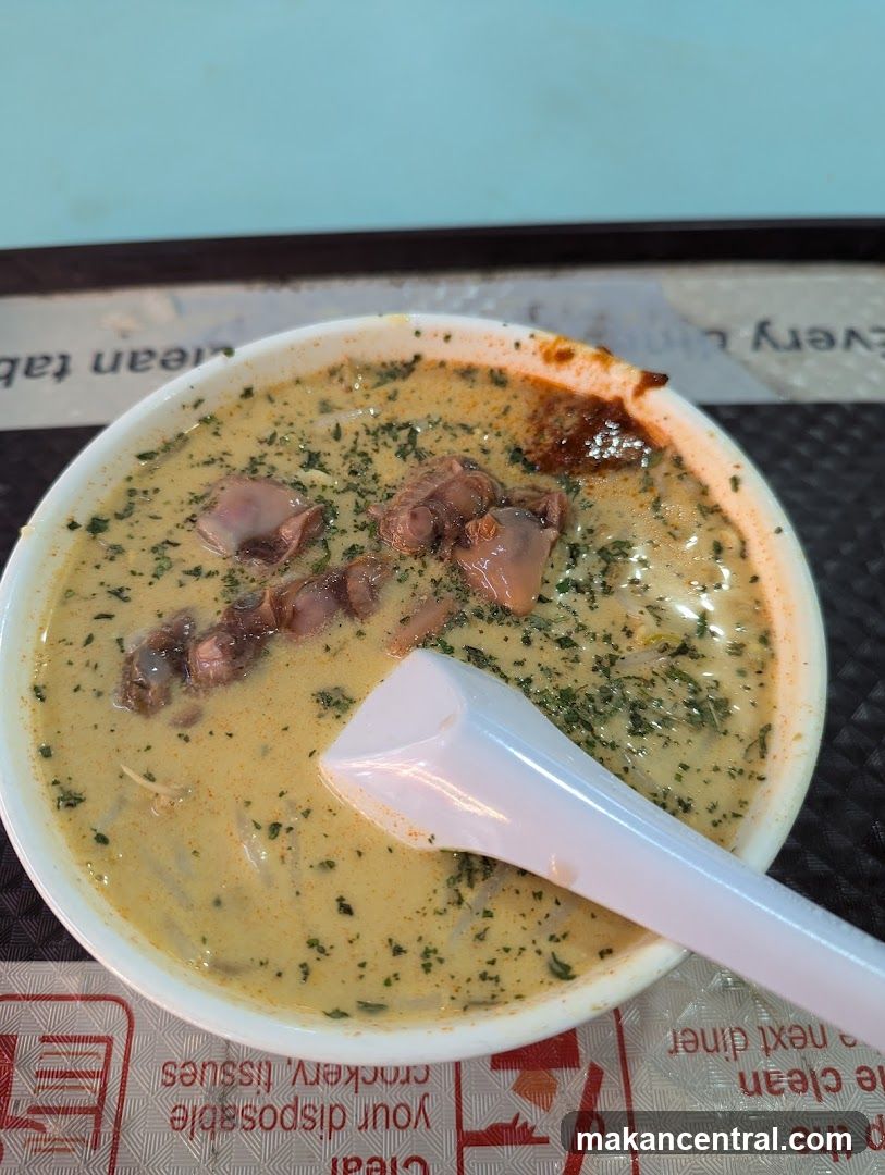 Bowl of Soup with Spoon