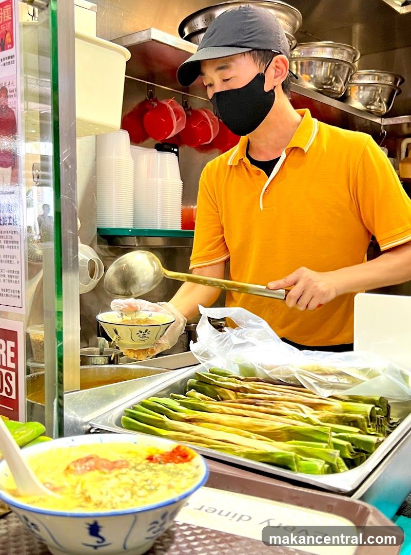 Food Stall Vendor Serving Soup