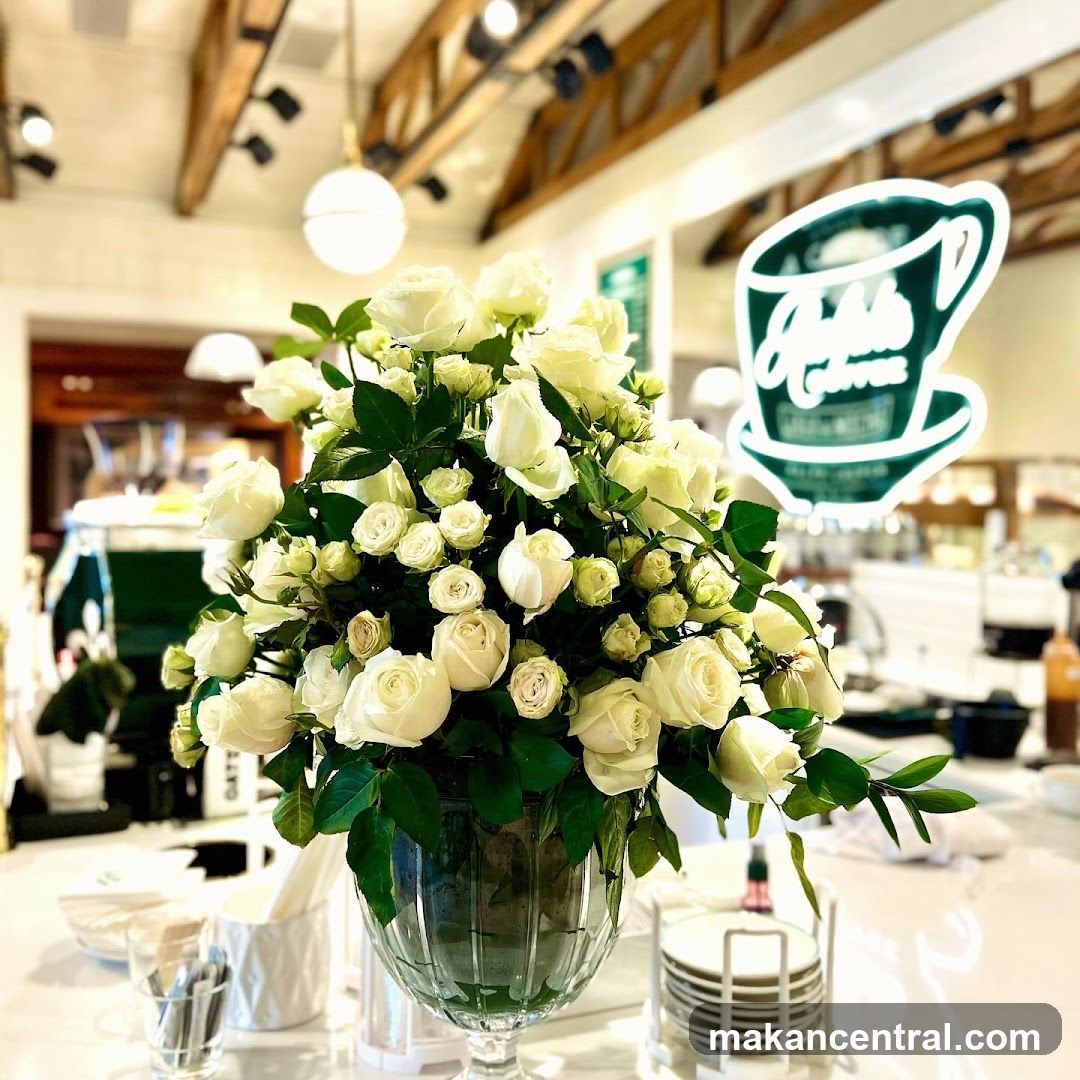 White Roses on Counter with Coffee Cup Logo