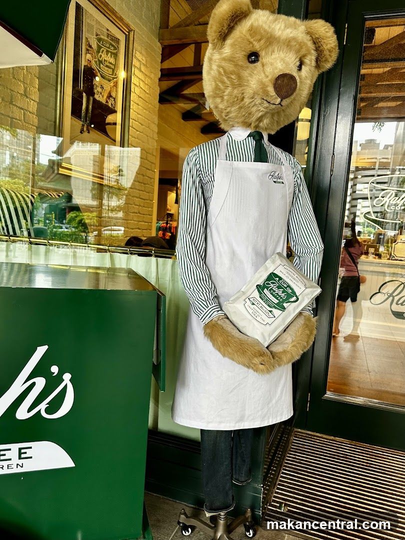 Teddy Bear Mannequin in Apron Holding Coffee Bag