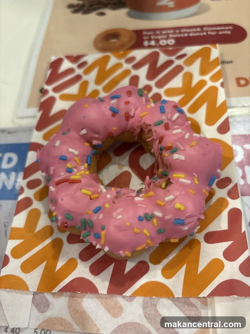 Pink Frosted Donut with Sprinkles