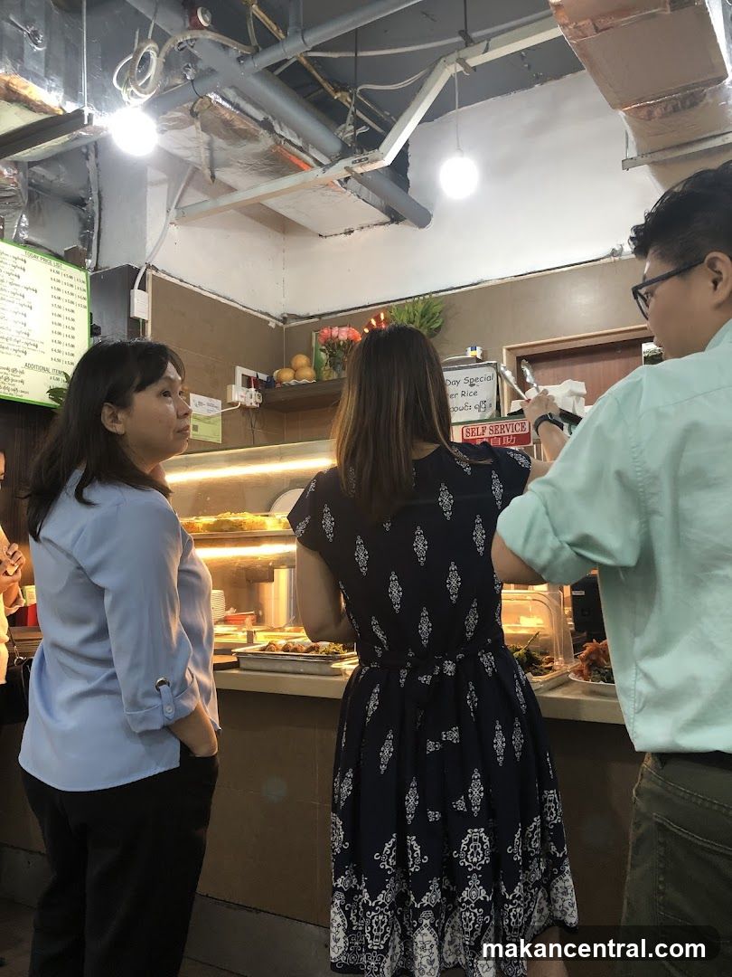 People at a food counter
