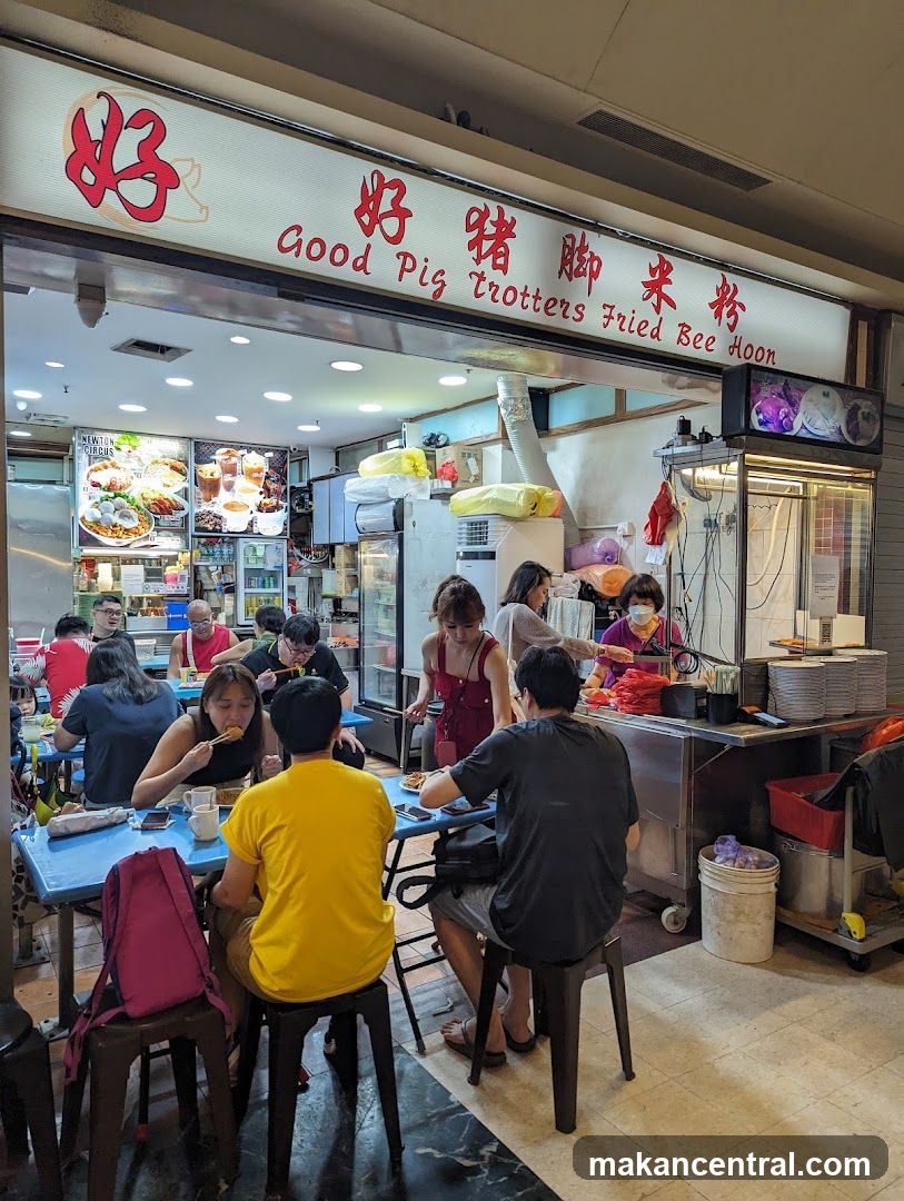 People eating at a food stall