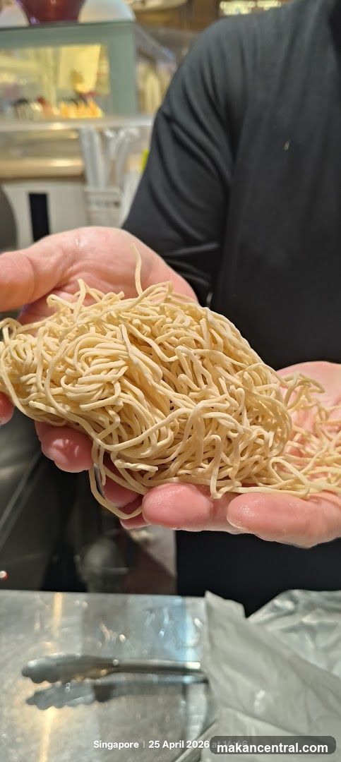 Hands holding noodles