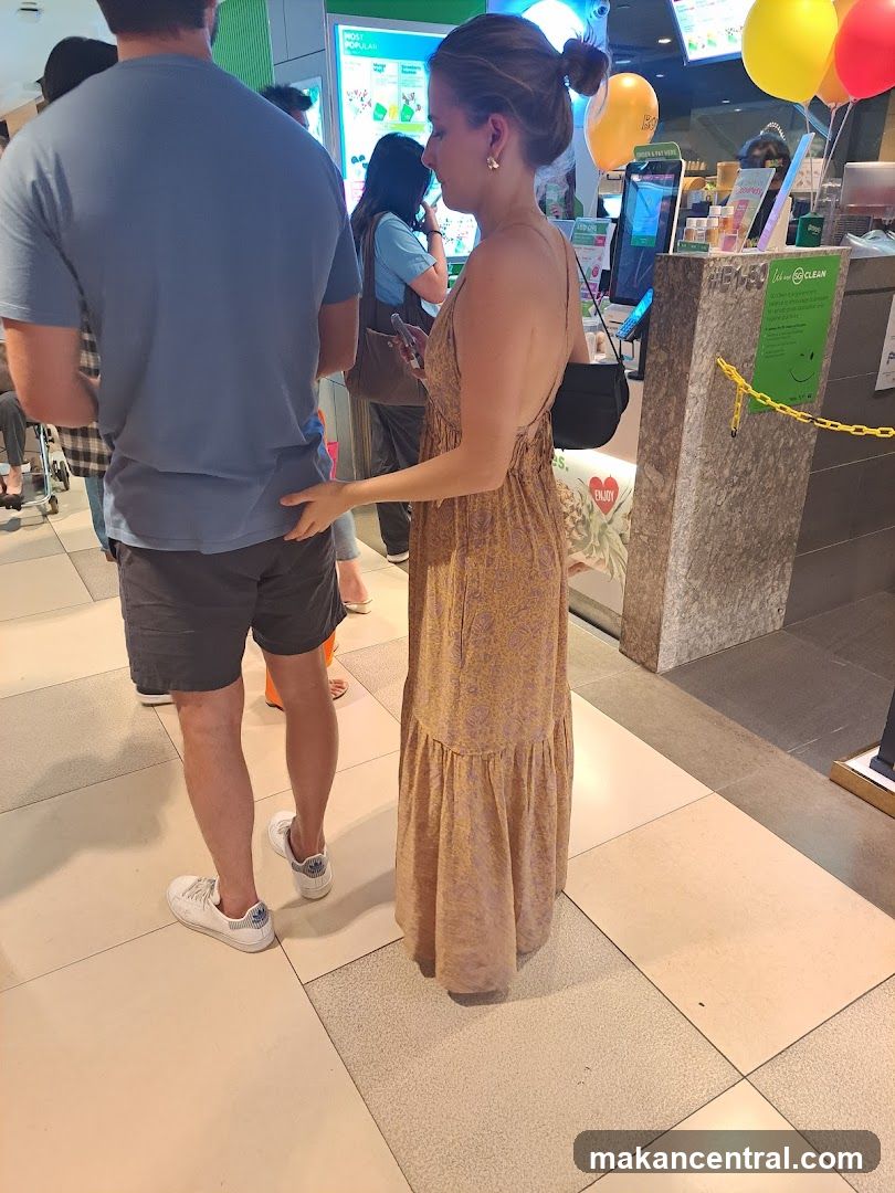 People in line at a food establishment