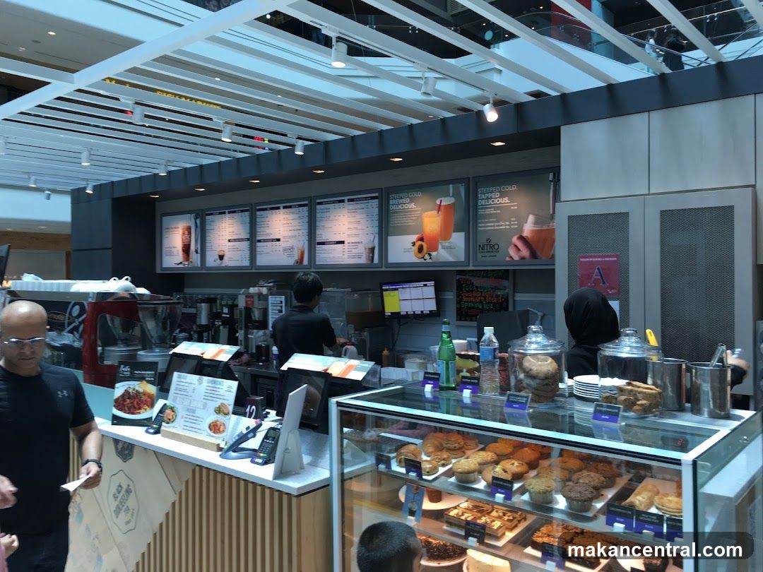 Coffee shop counter with pastries and drinks