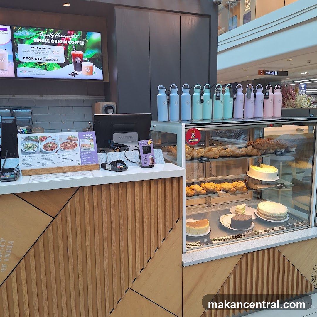 Coffee Shop Counter with Pastries and Drinks