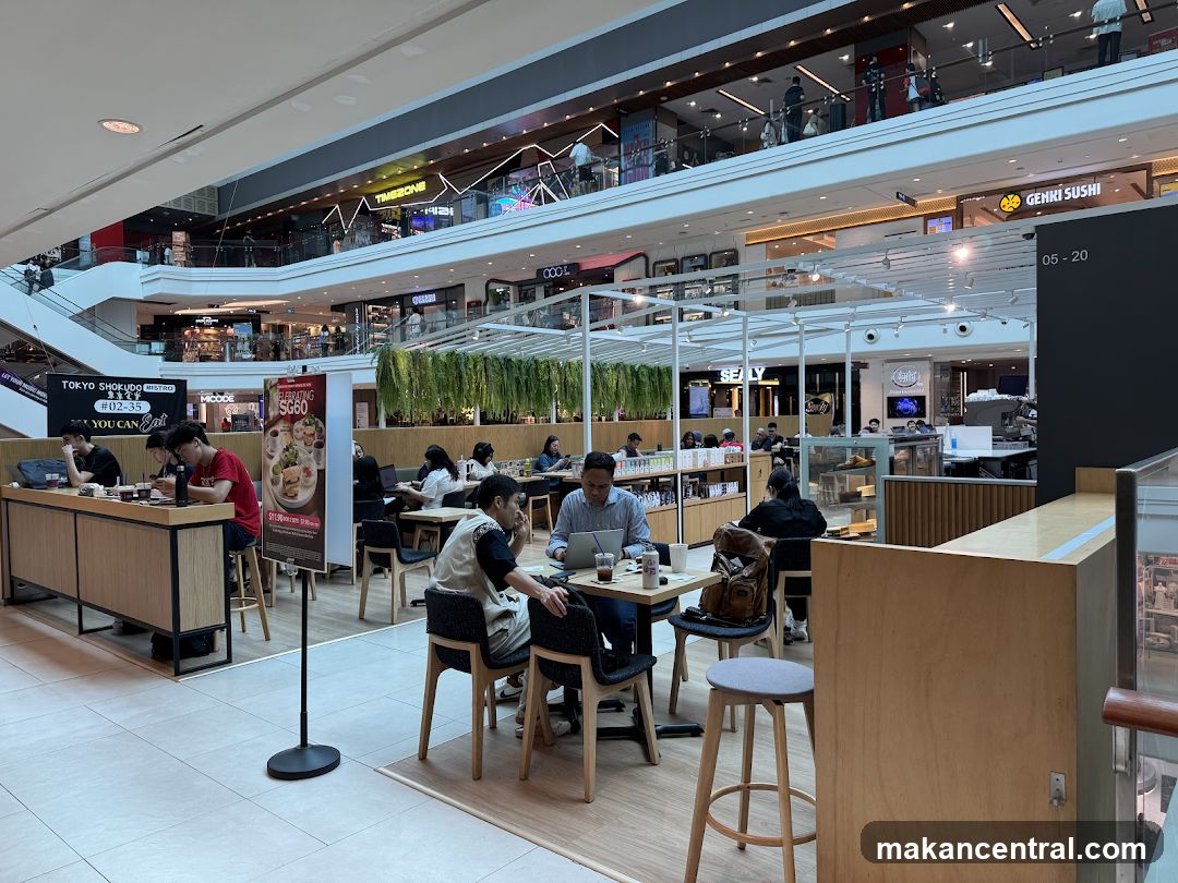 Indoor mall food court with diners