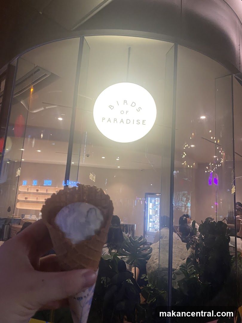Ice Cream Cone in Front of Storefront
