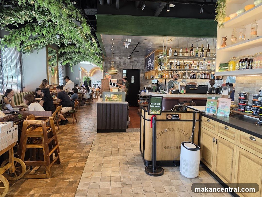 Interior of a cafe with greenery and bar