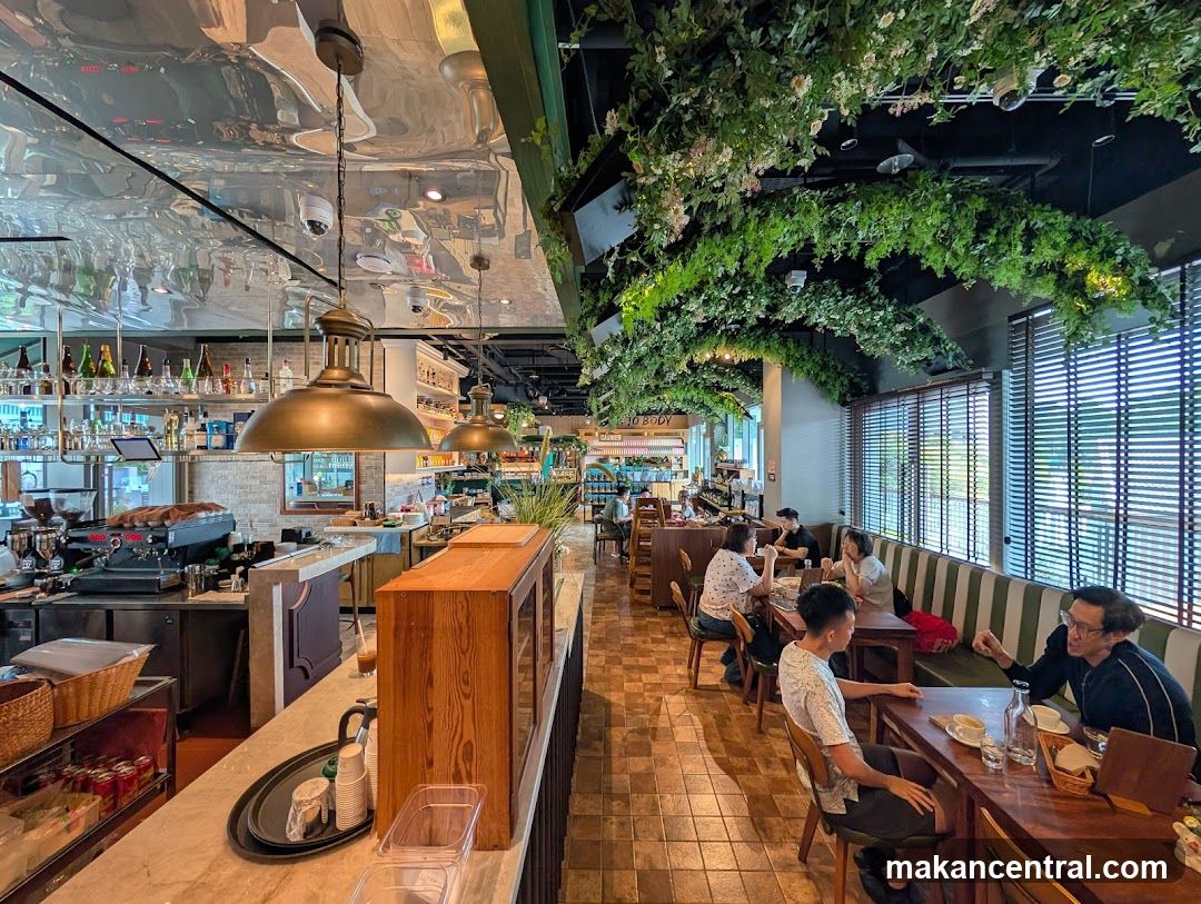 Interior of a cafe with lush greenery