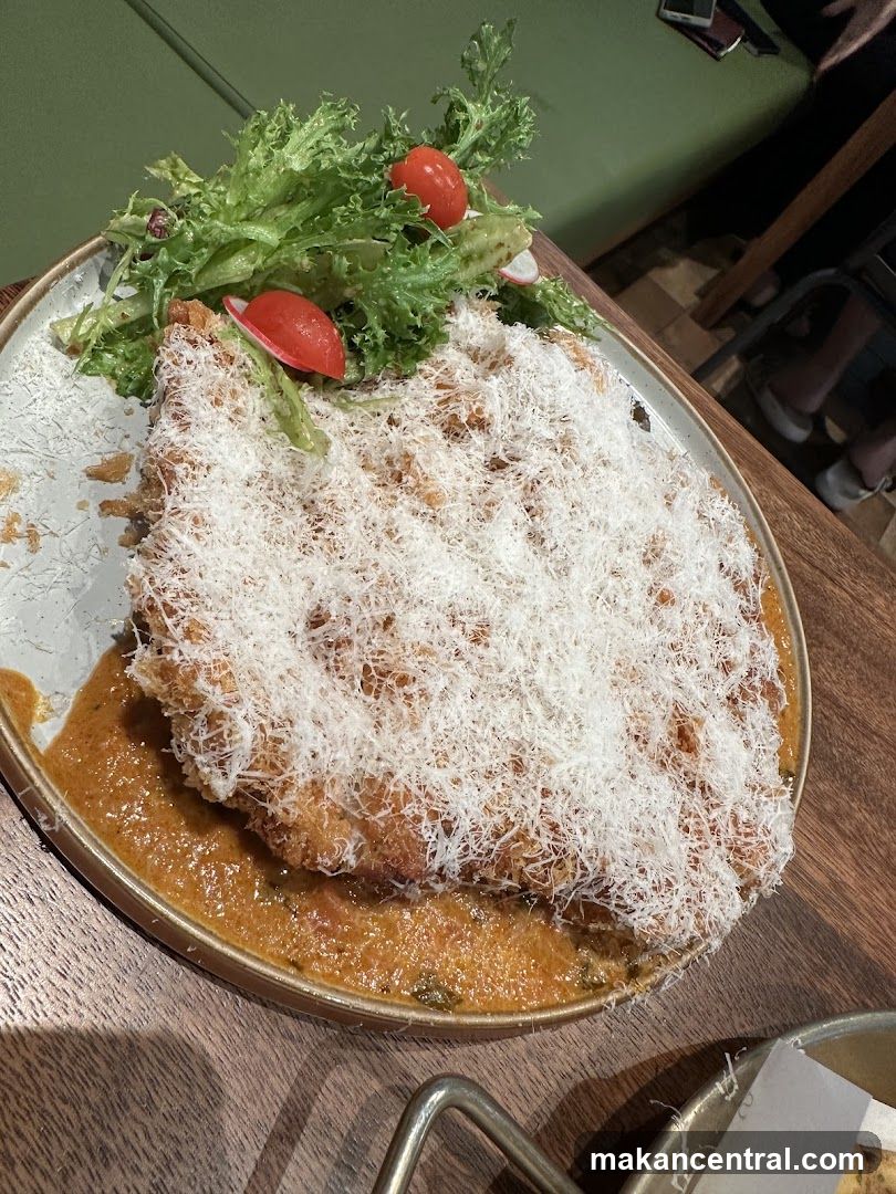 Breaded cutlet with cheese and salad