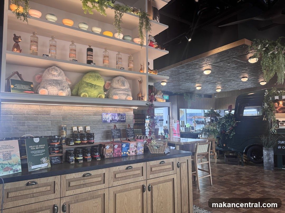Interior of a shop with shelves of products and a vintage truck