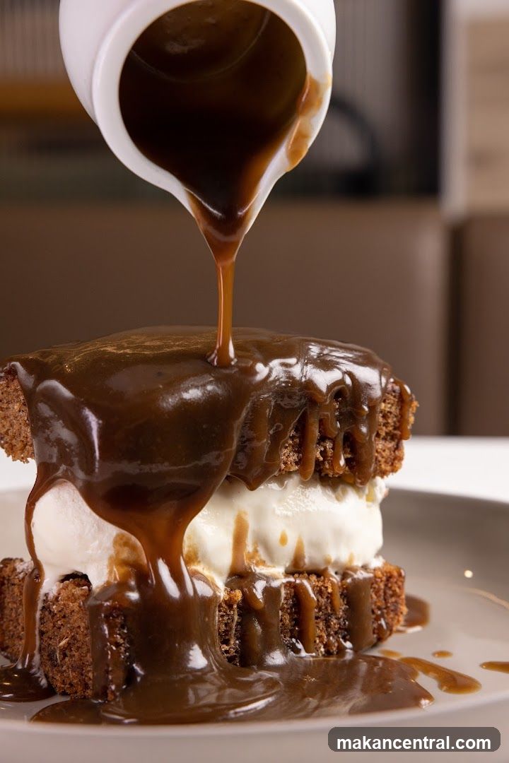 Dessert being drizzled with sauce