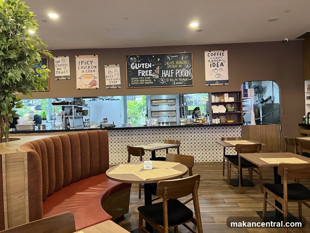 Restaurant Interior with Seating and Kitchen View