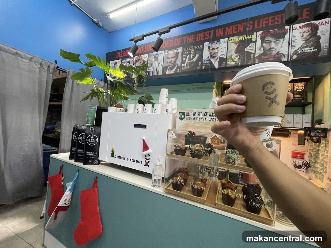 Coffee shop counter with pastries and coffee cup