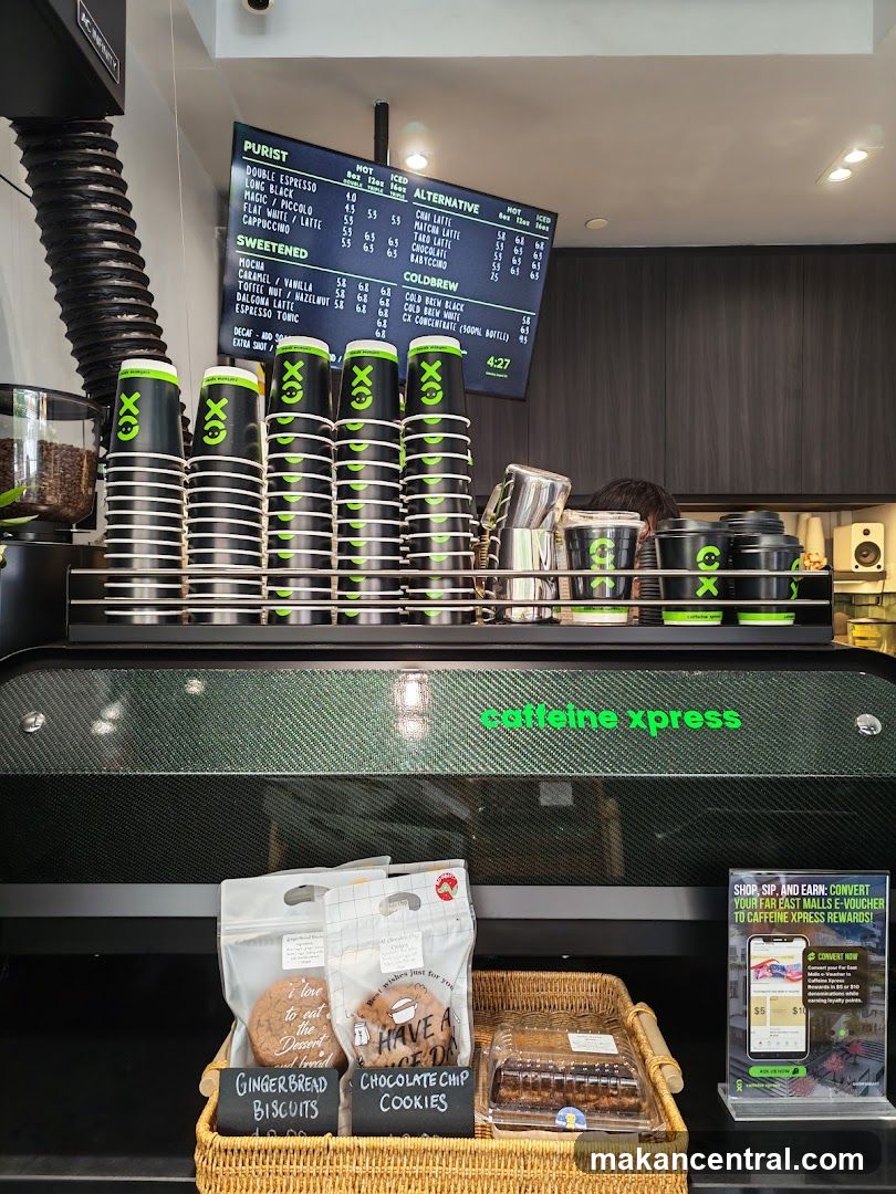 Coffee shop counter with menu and baked goods