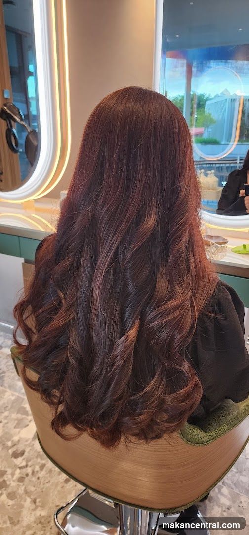 Woman with styled auburn hair